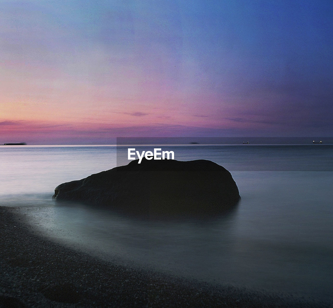 Scenic view of sea against sky at sunset