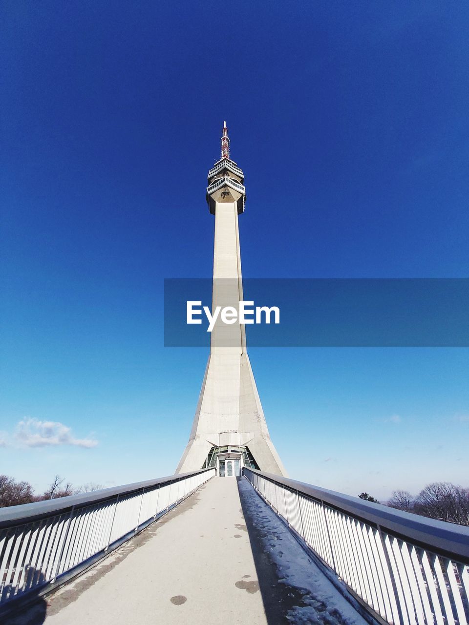 LOW ANGLE VIEW OF COMMUNICATIONS TOWER AGAINST SKY