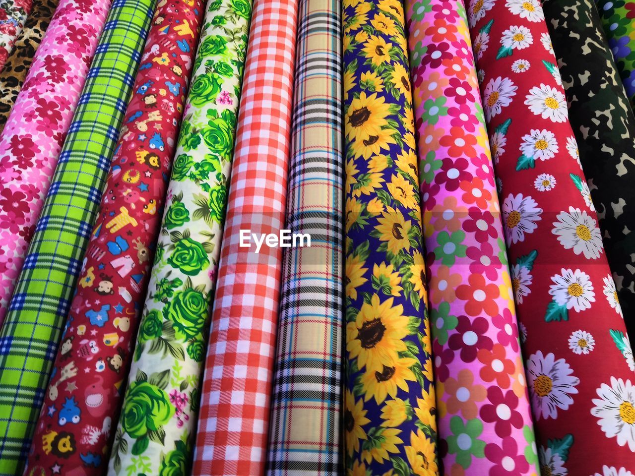 Full frame shot of multi colored fabrics for sale in market