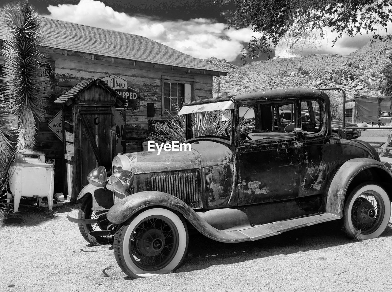 VINTAGE CAR PARKED ON ROAD