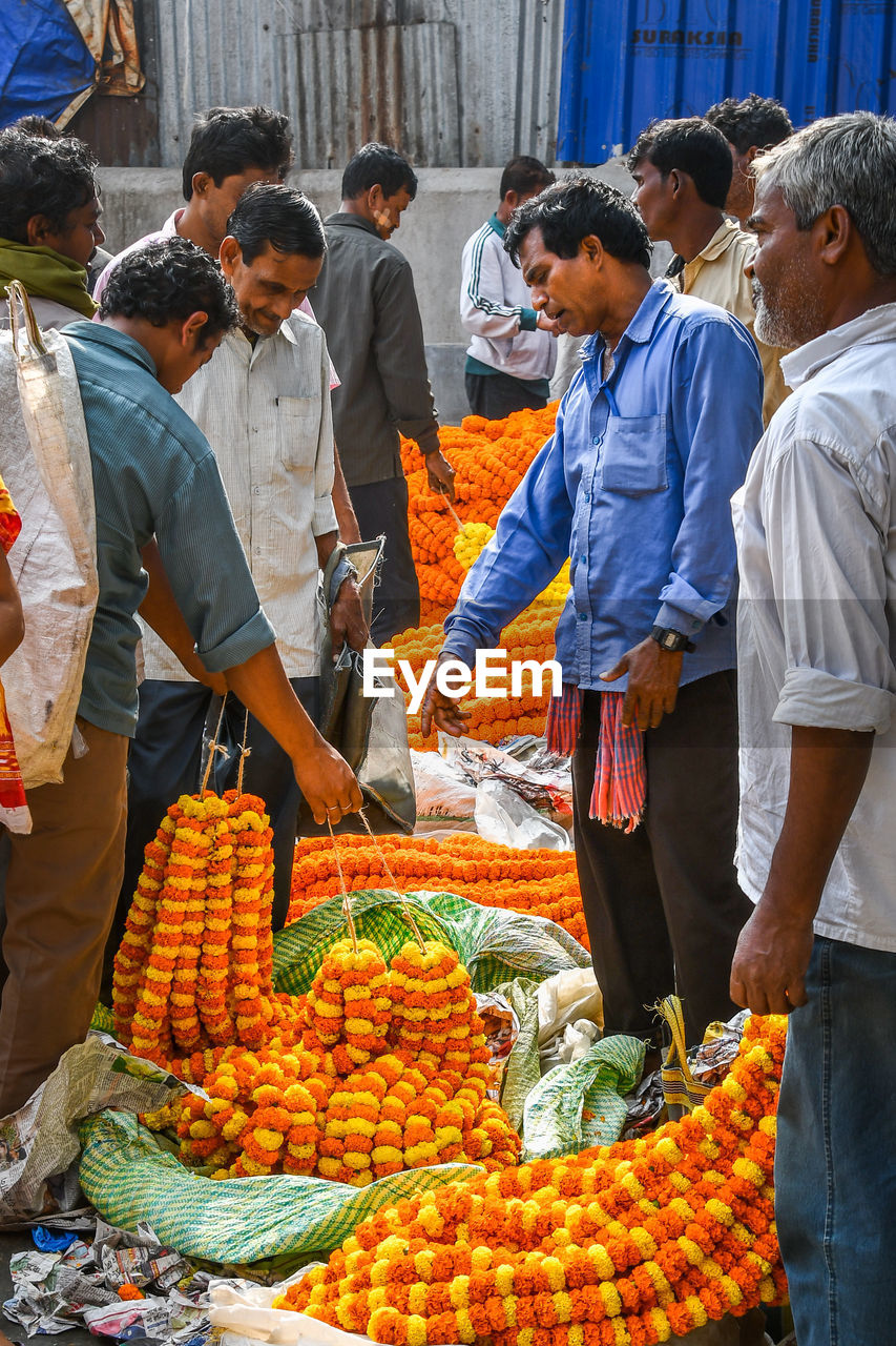 GROUP OF PEOPLE FOR SALE AT MARKET