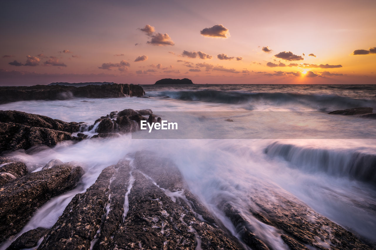 Scenic view of sea against sky during sunset