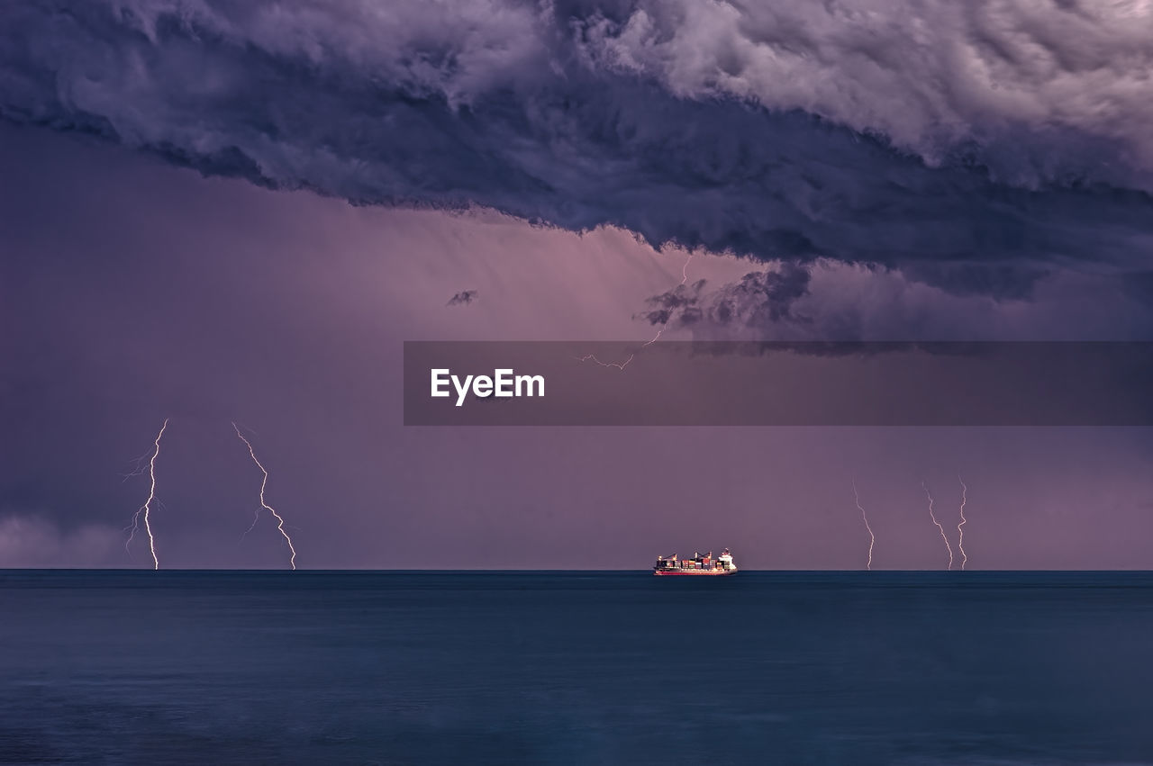 Storm with lightning and ship on the mediterranean sea