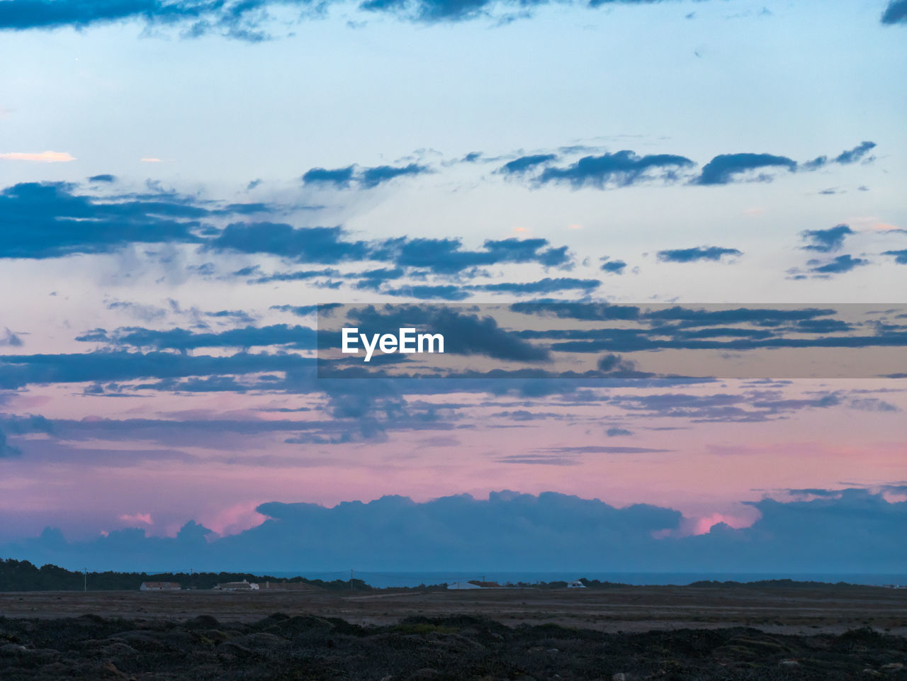 Scenic view of landscape against sky during sunset