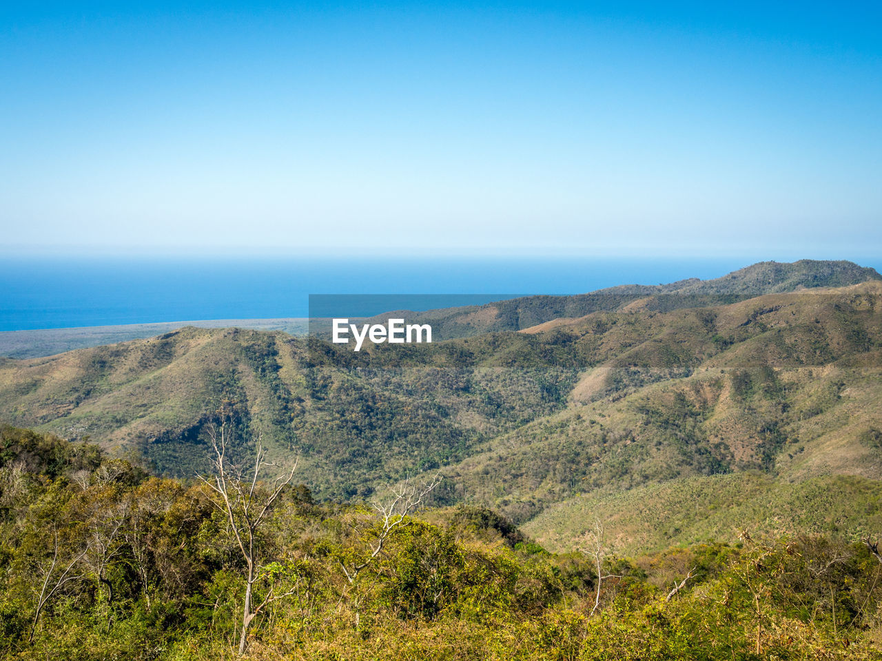 Scenic view of landscape with mountain range in background
