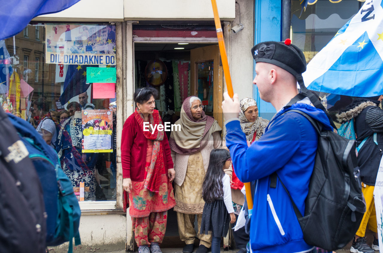 GROUP OF PEOPLE STANDING IN FRONT OF AN EMPTY