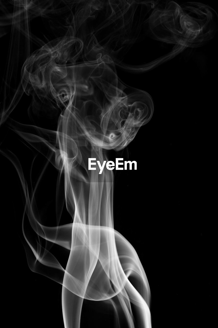 Close-up of smoke against black background