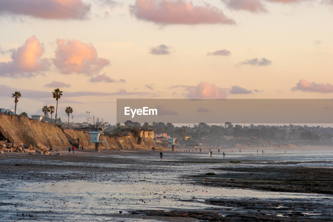 Scenic view of beach against sky during sunset