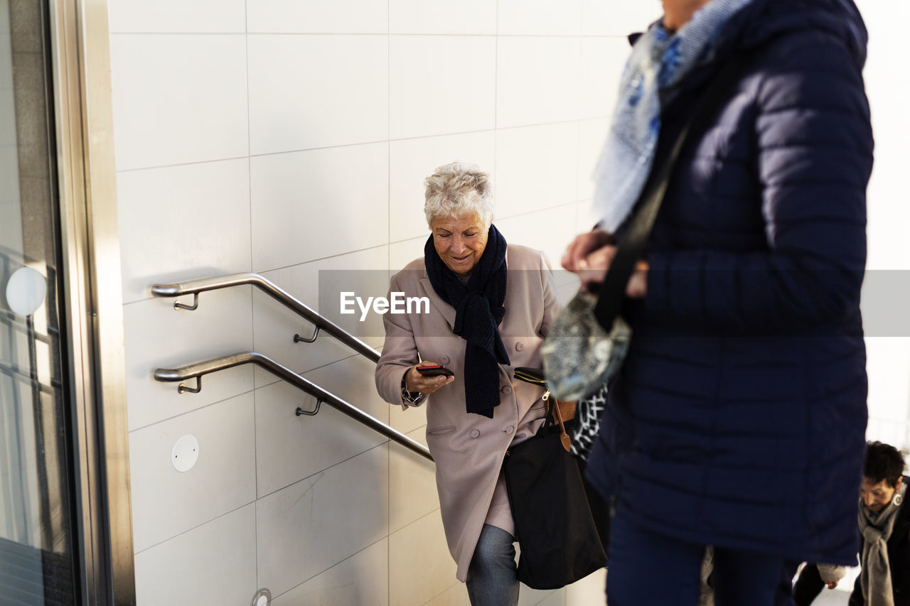 Senior woman on staircase