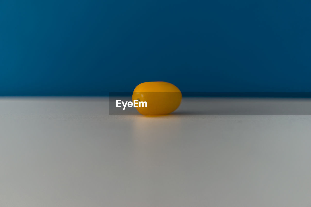 Close-up of yellow tomato on table