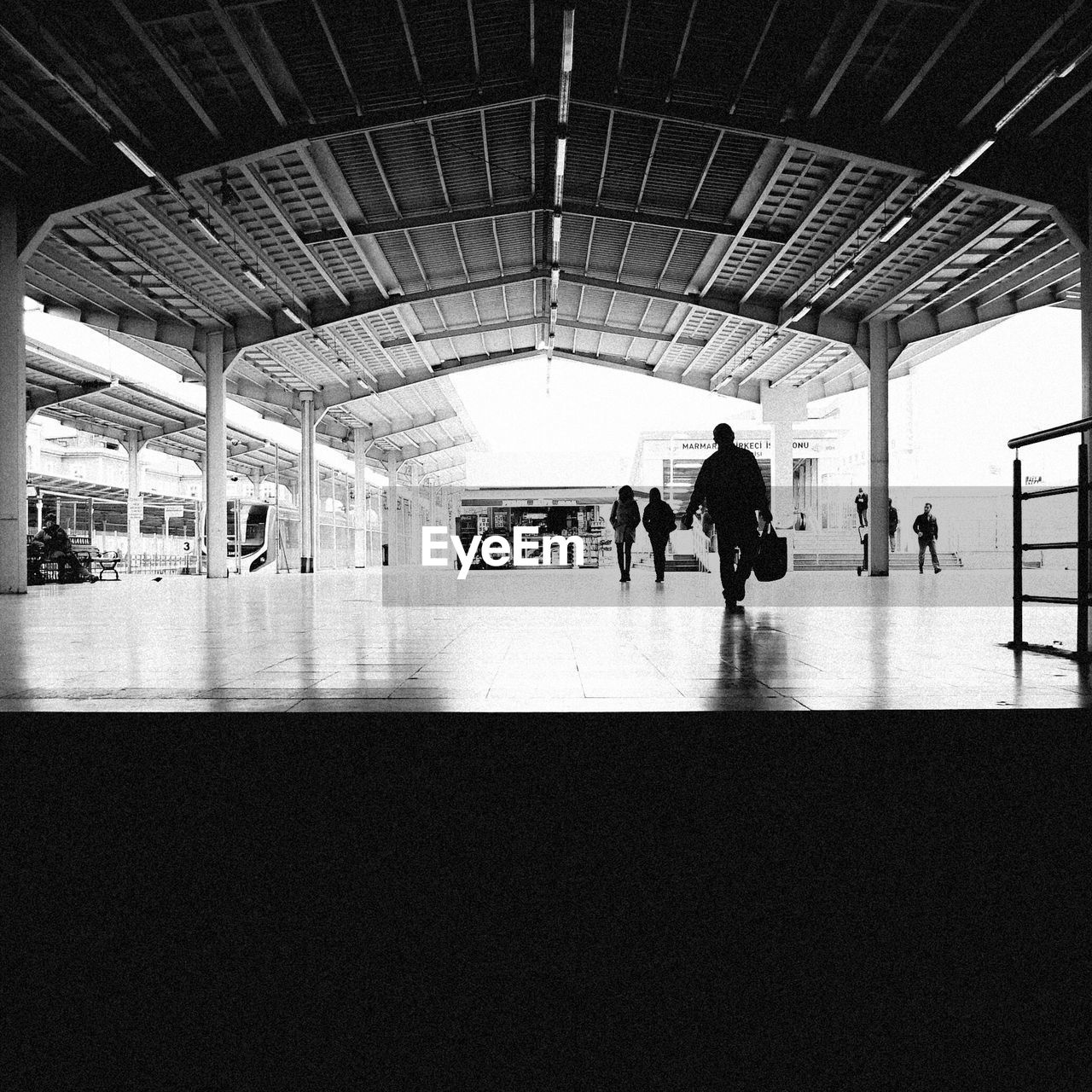 Silhouette people walking in lobby