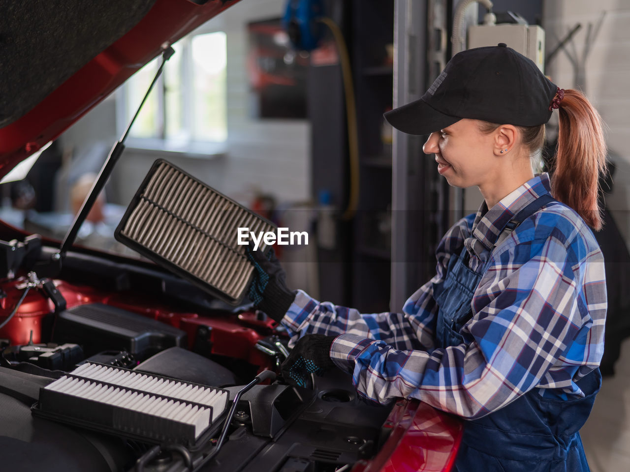 side view of man working at gas station