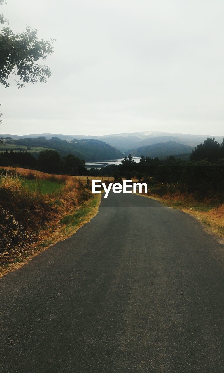 ROAD PASSING THROUGH LANDSCAPE