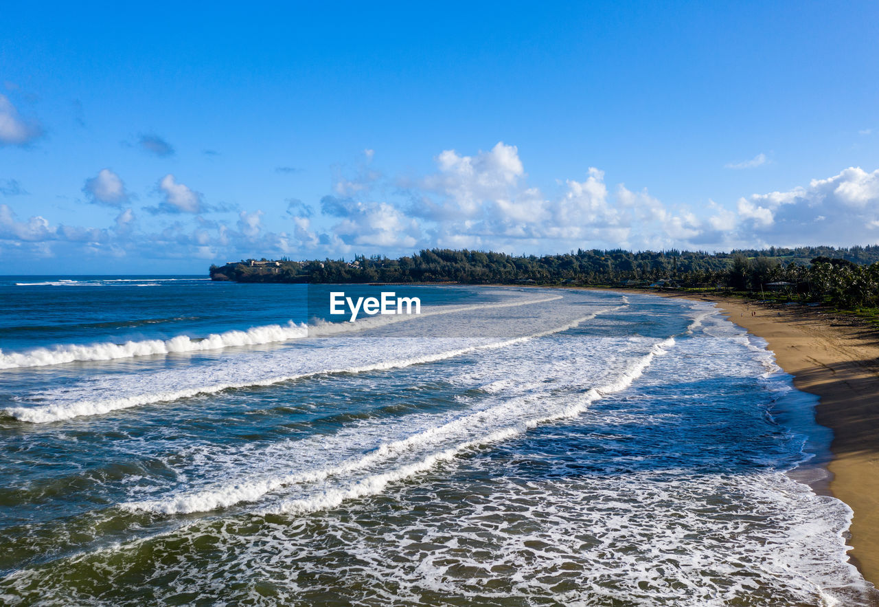 Aerial panoramic image at sunrise off the coast over hanalei bay and waioli beach park on kauai