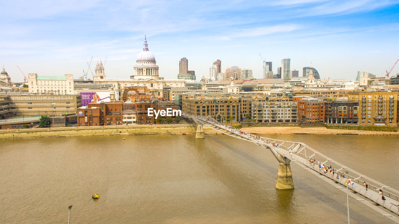 High angle view of millennium bridge over thames river in city