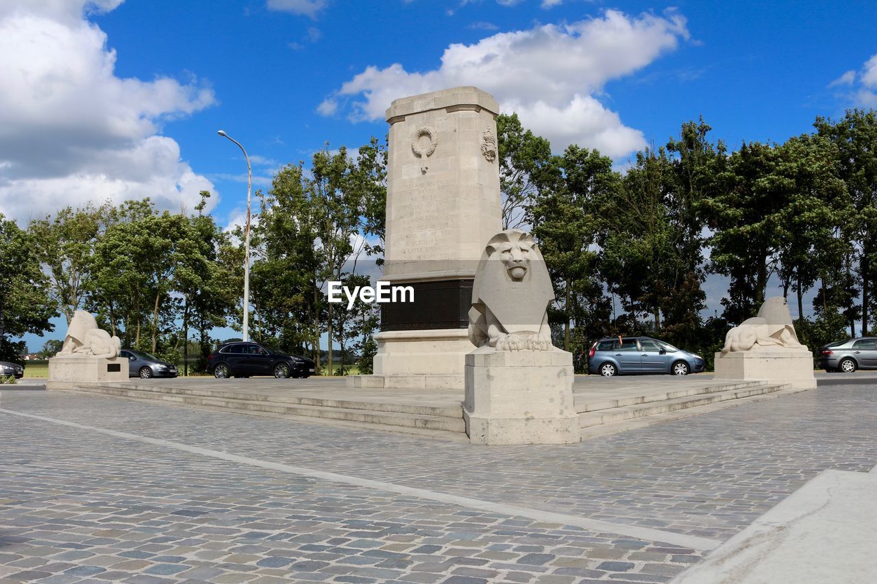 STATUE AGAINST BUILDING