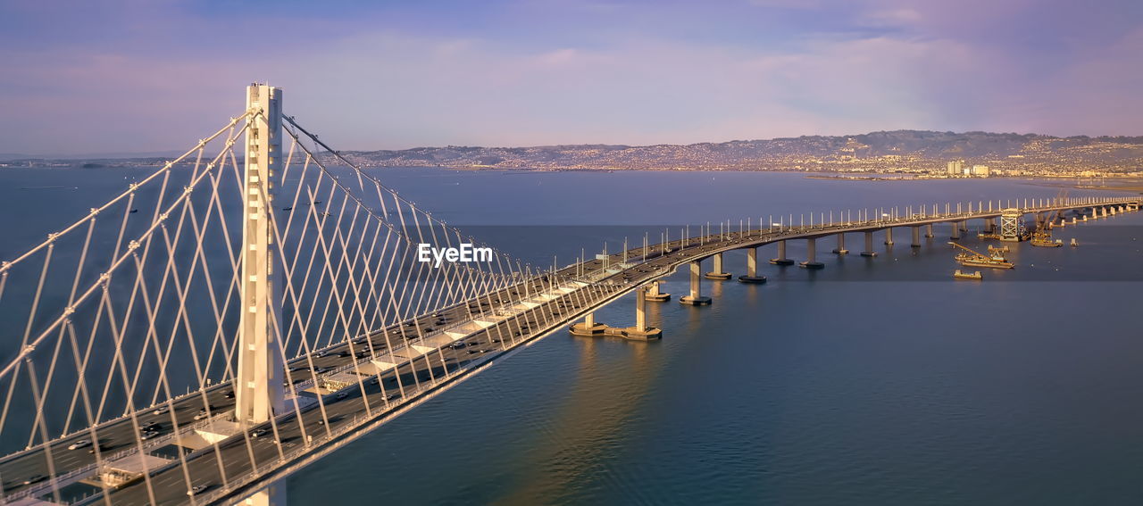 Panoramic view of suspension bridge over sea