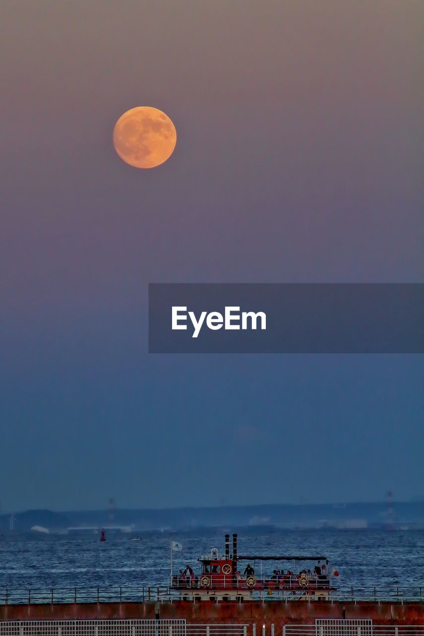 Scenic view of sea against sky at evening