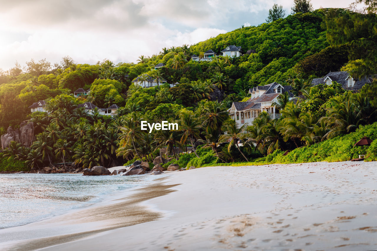 Scenic view of exotic tropical beach anse intendance in evening sunset light