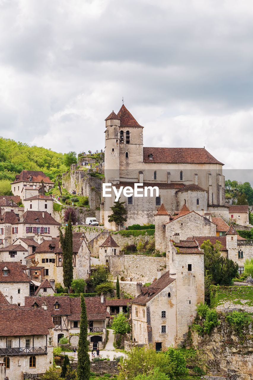 View of saint-cirq-lapopie village with catholic church, france