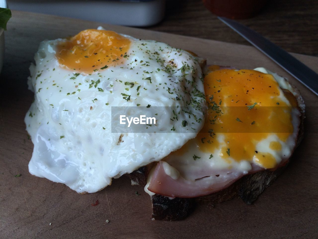 Fried egg and bacon on slice of bread