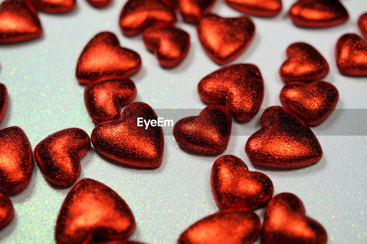 Close-up of red heart shape chocolates on table