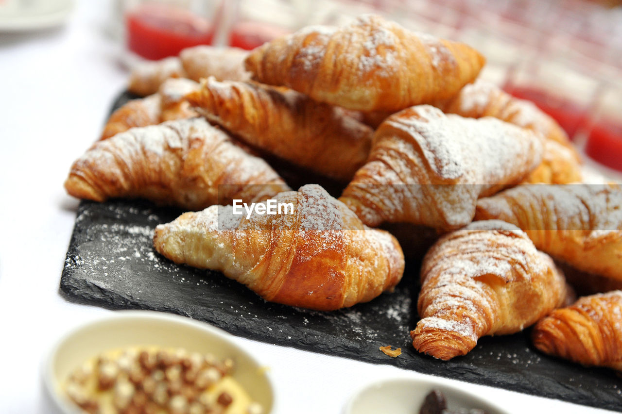 Close-up of brioche for breakfast in plate on table - croissant