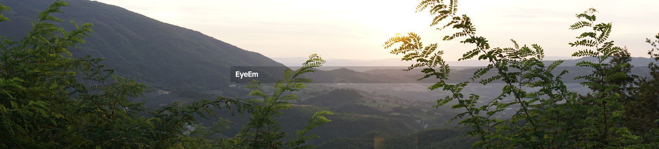 Scenic view of mountains against sky during sunset