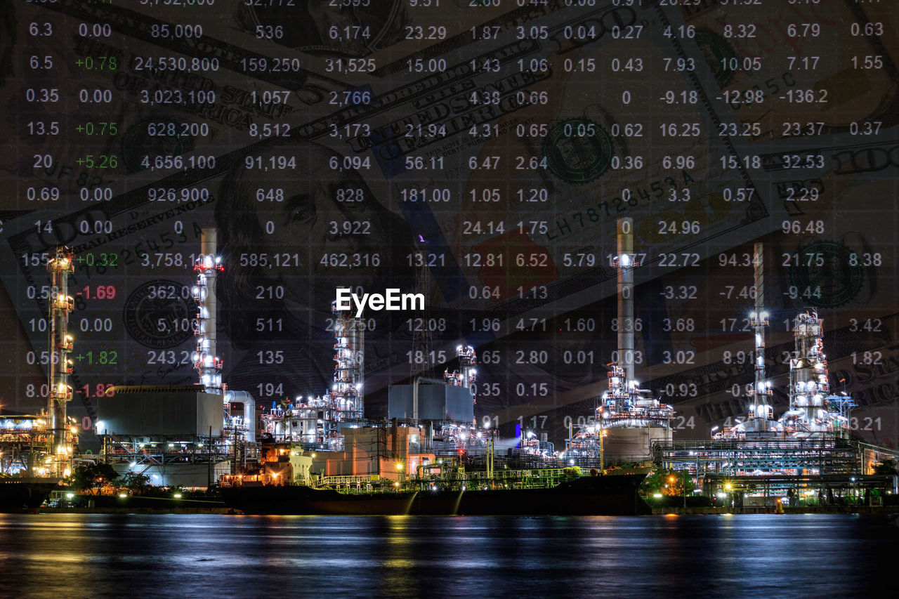 VIEW OF ILLUMINATED CITY AT NIGHT