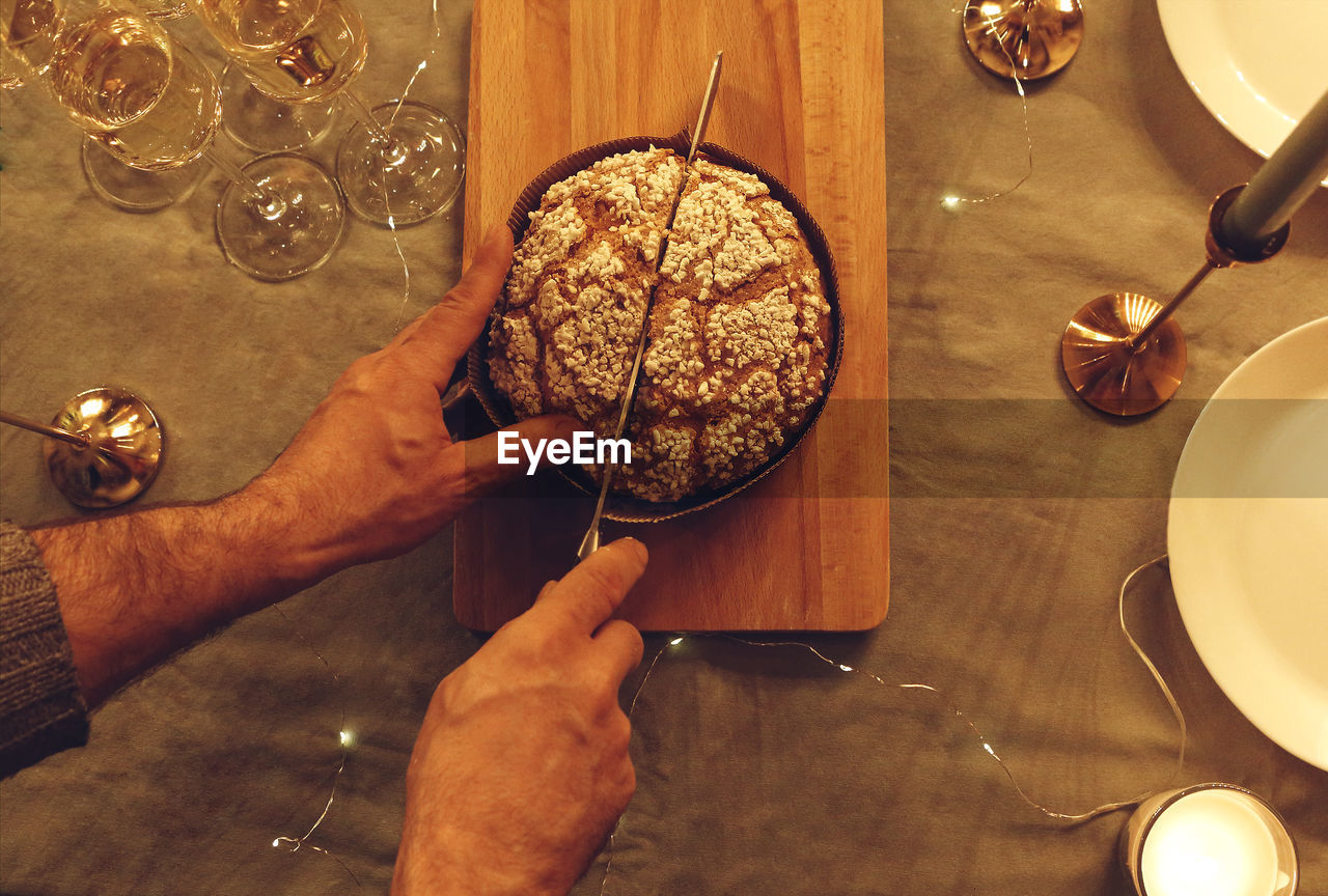 cropped hands of person preparing food in plate