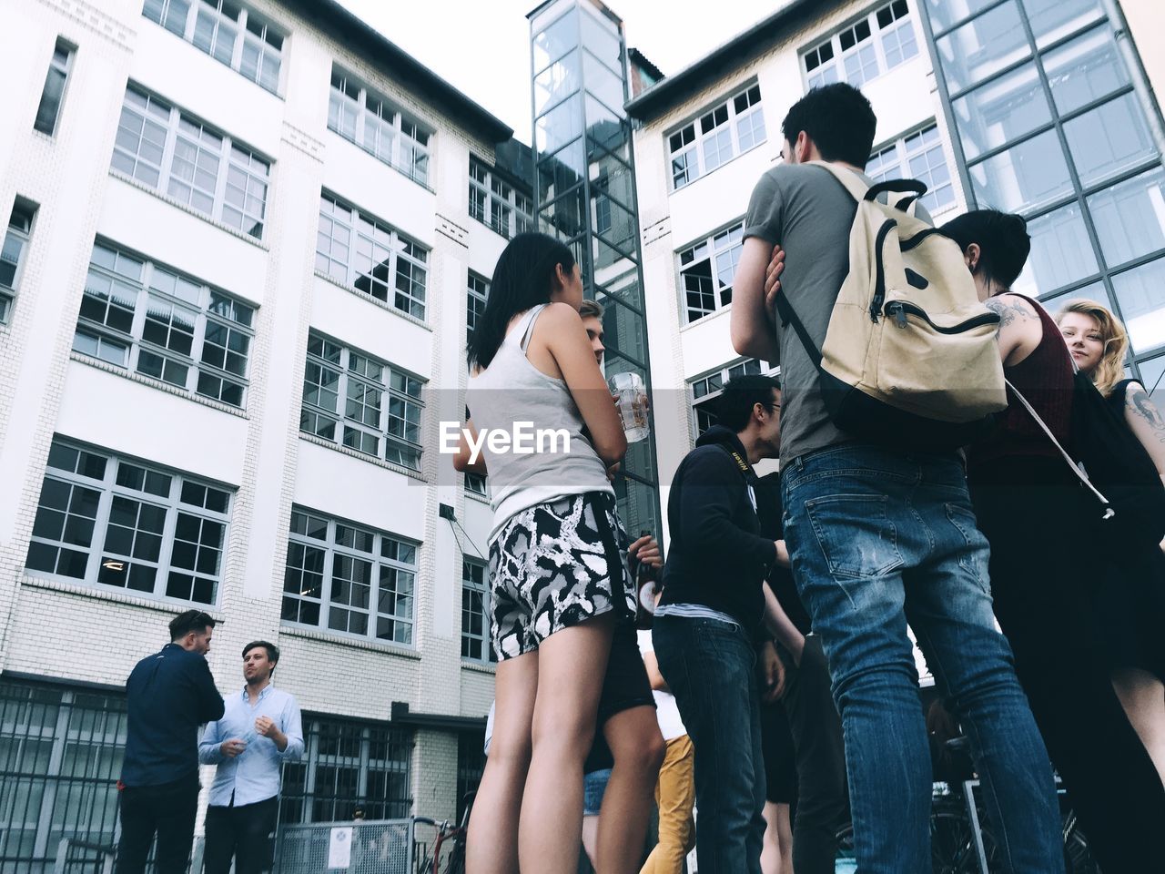 REAR VIEW OF YOUNG WOMAN PHOTOGRAPHING