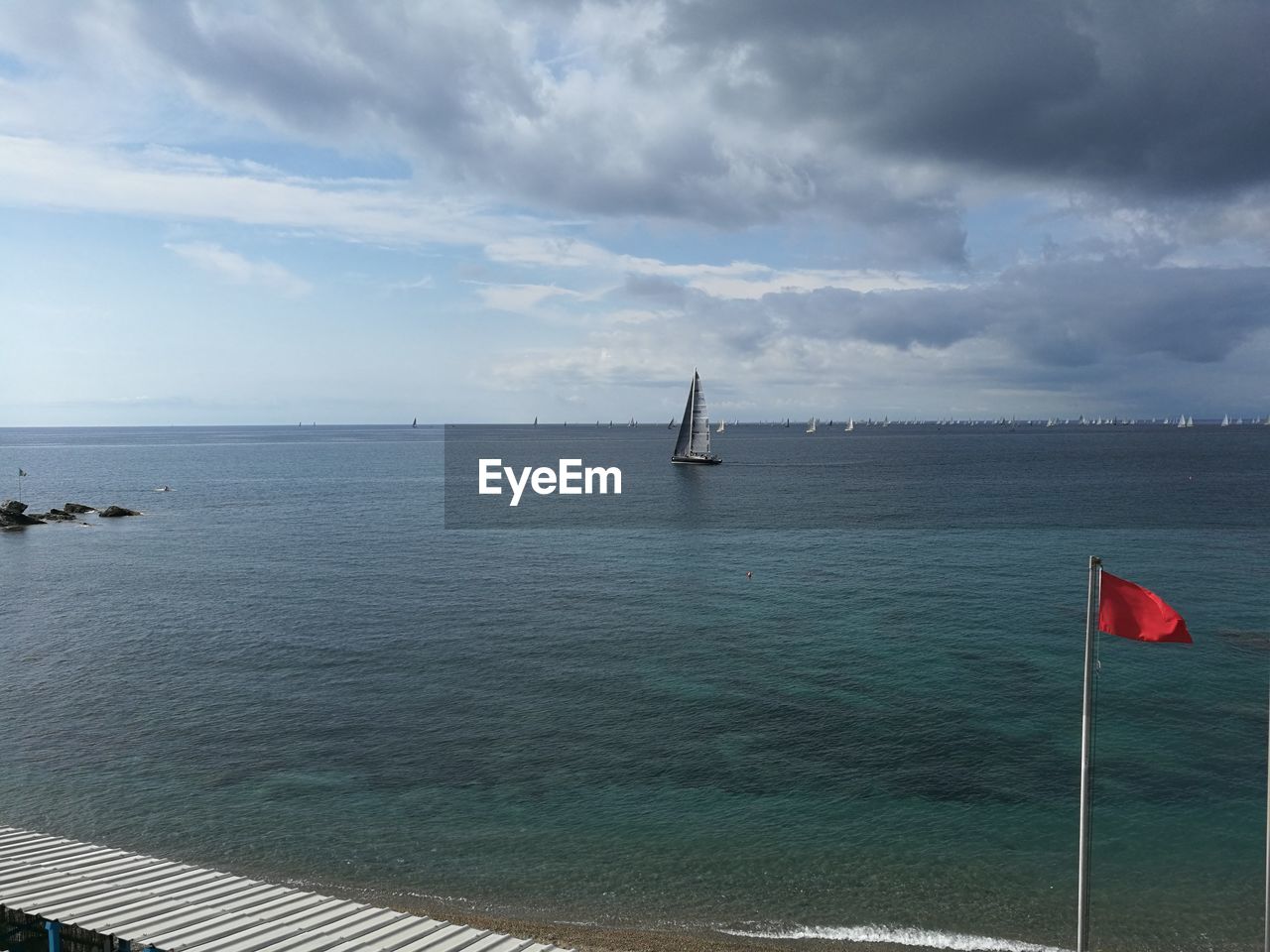 BOAT IN SEA AGAINST SKY