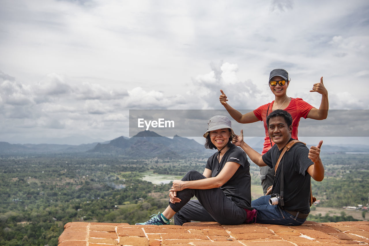 Three friends on top of the rock fortress of sigiriya