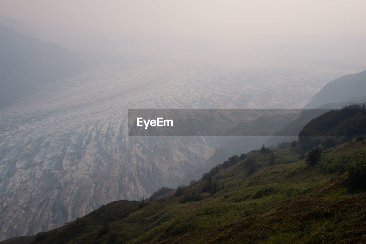 SCENIC VIEW OF MOUNTAIN AGAINST SKY