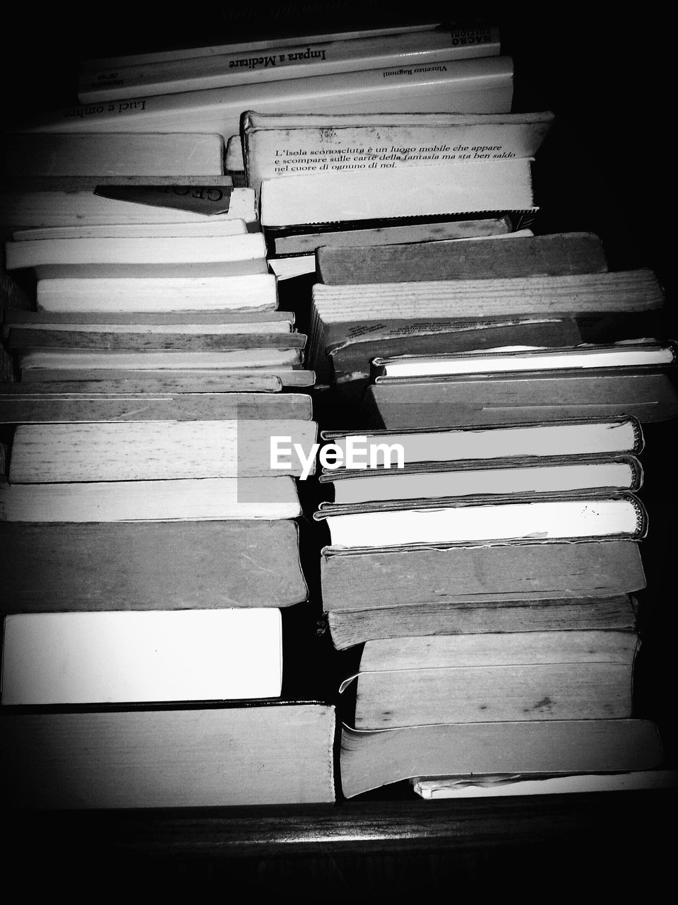 Close-up of stacked books on table