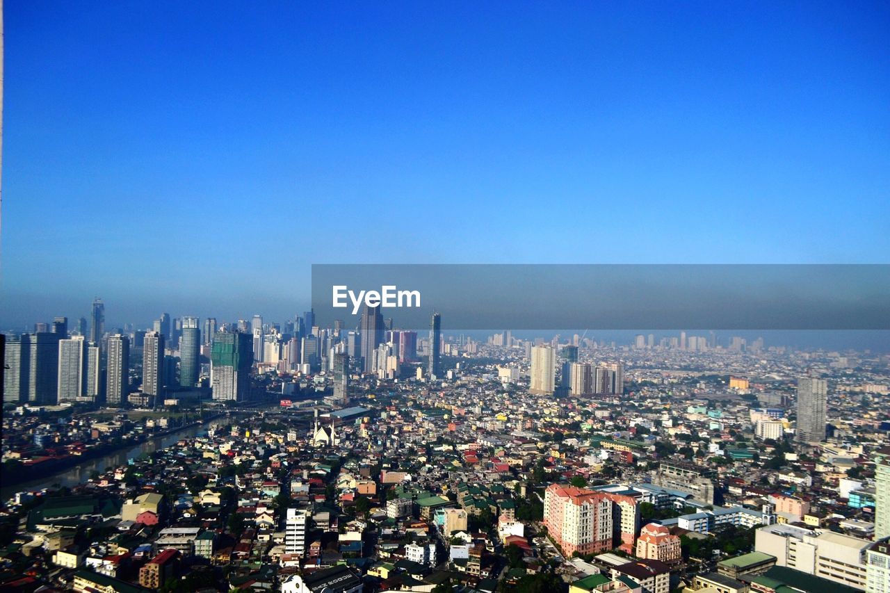 Aerial view of cityscape against sky