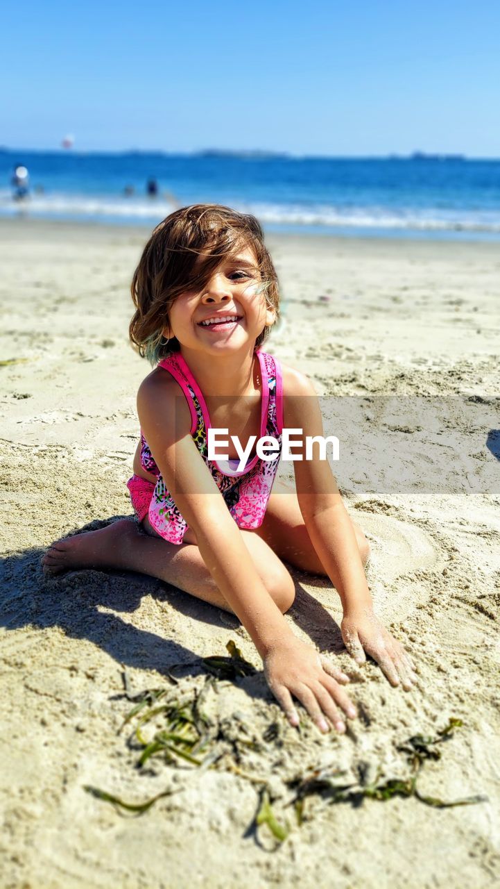 Portrait of a smiling young woman on beach