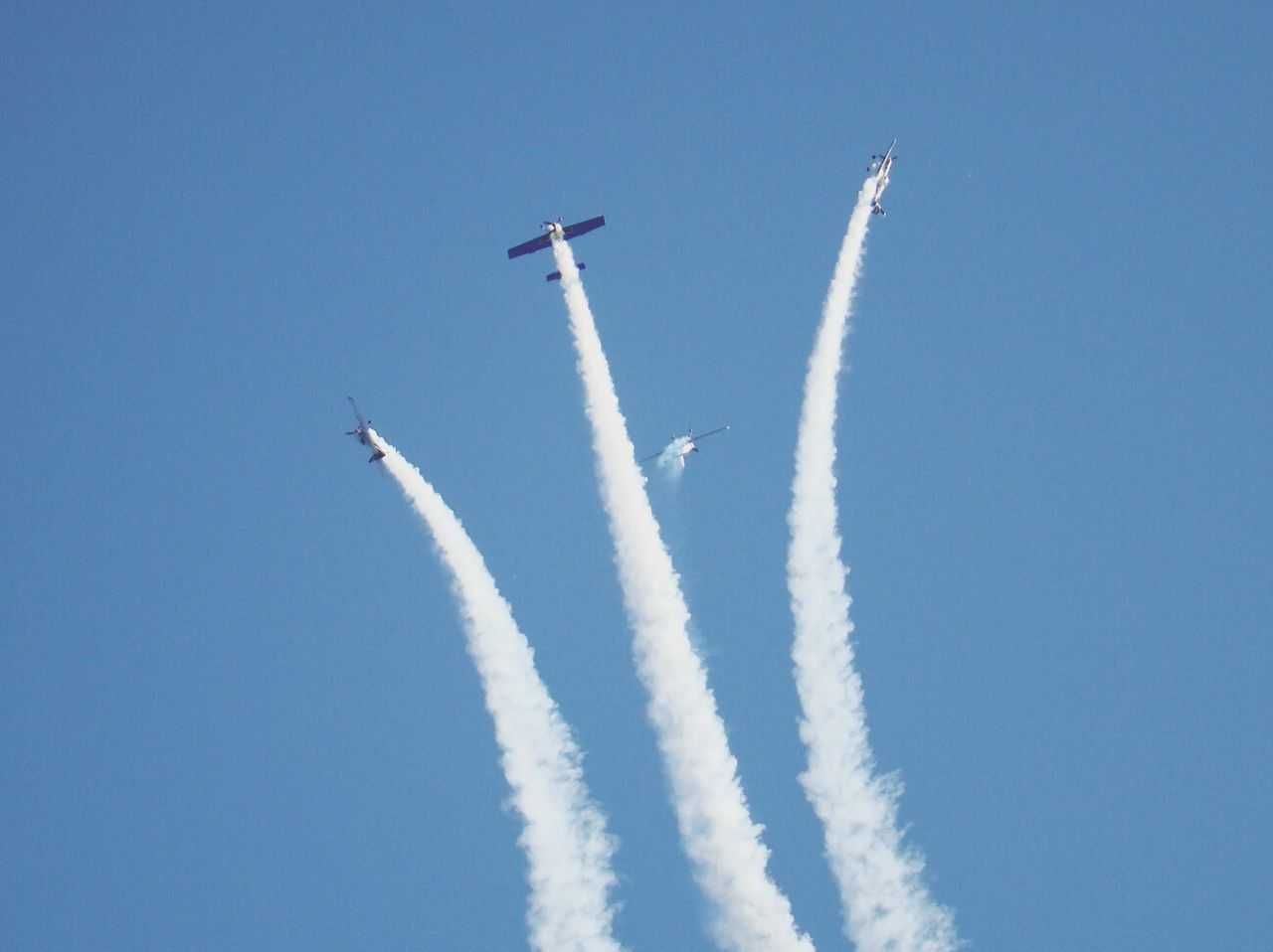 Low angle view of aerobatics team in flight