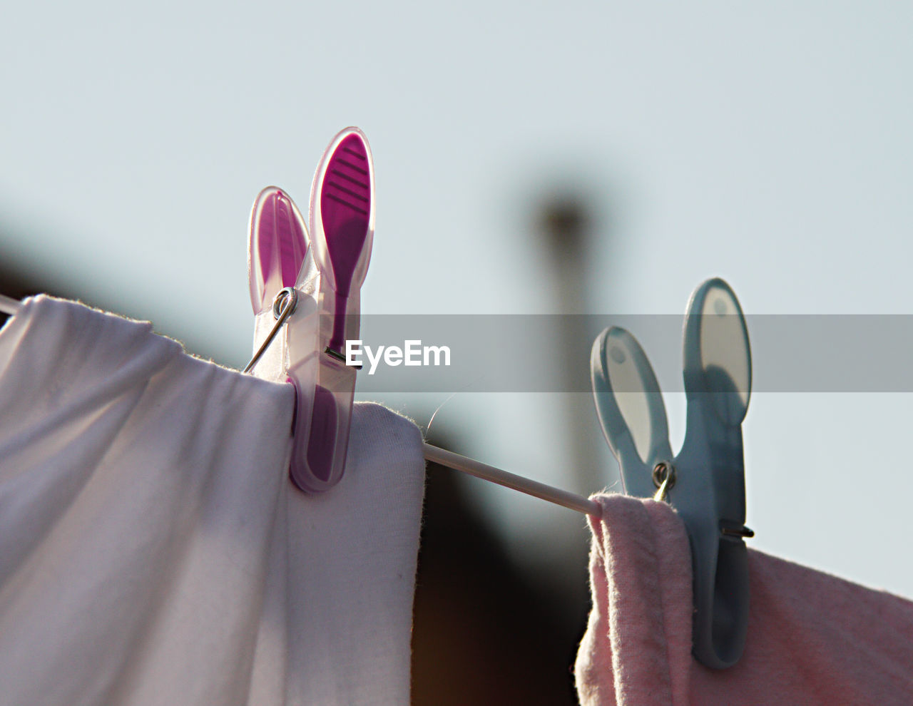CLOSE-UP OF CLOTHES DRYING ON CLOTHESLINE