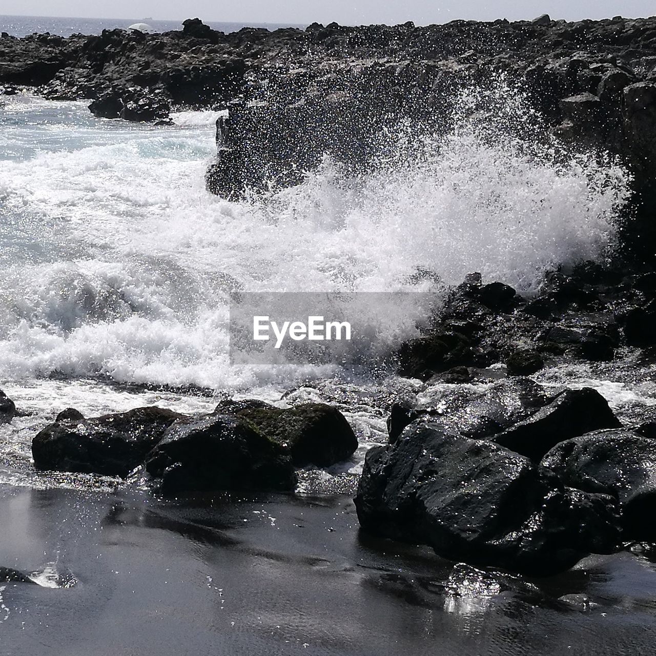 WAVES SPLASHING ON SHORE