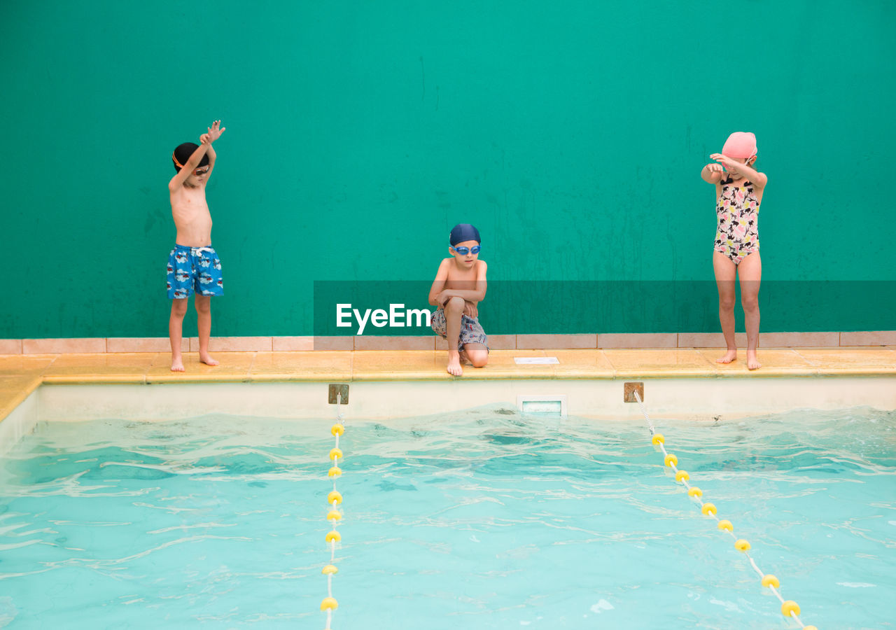 Full length of shirtless boy in swimming pool