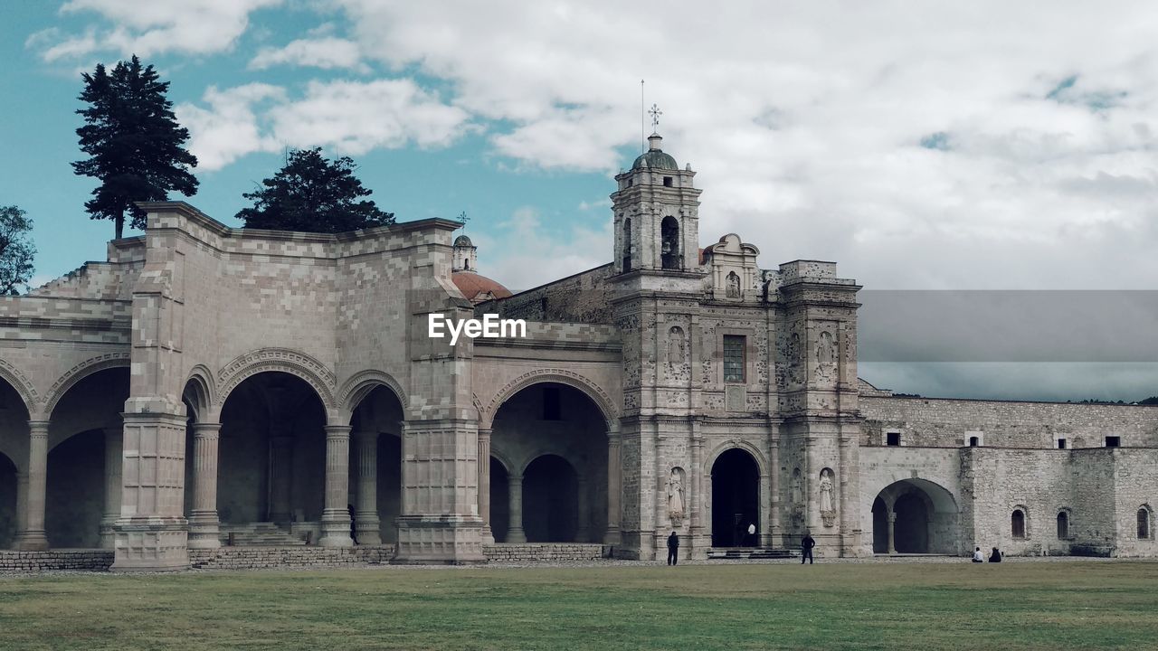 Historic building against cloudy sky