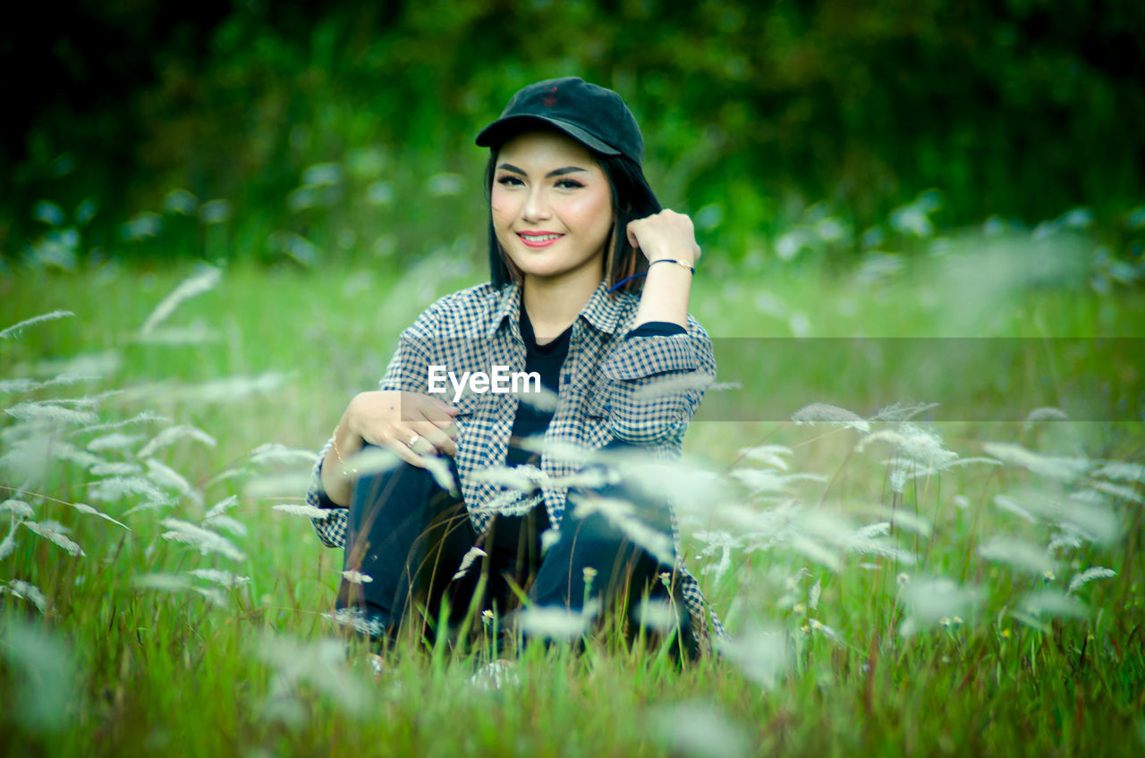 Young woman smiling on field
