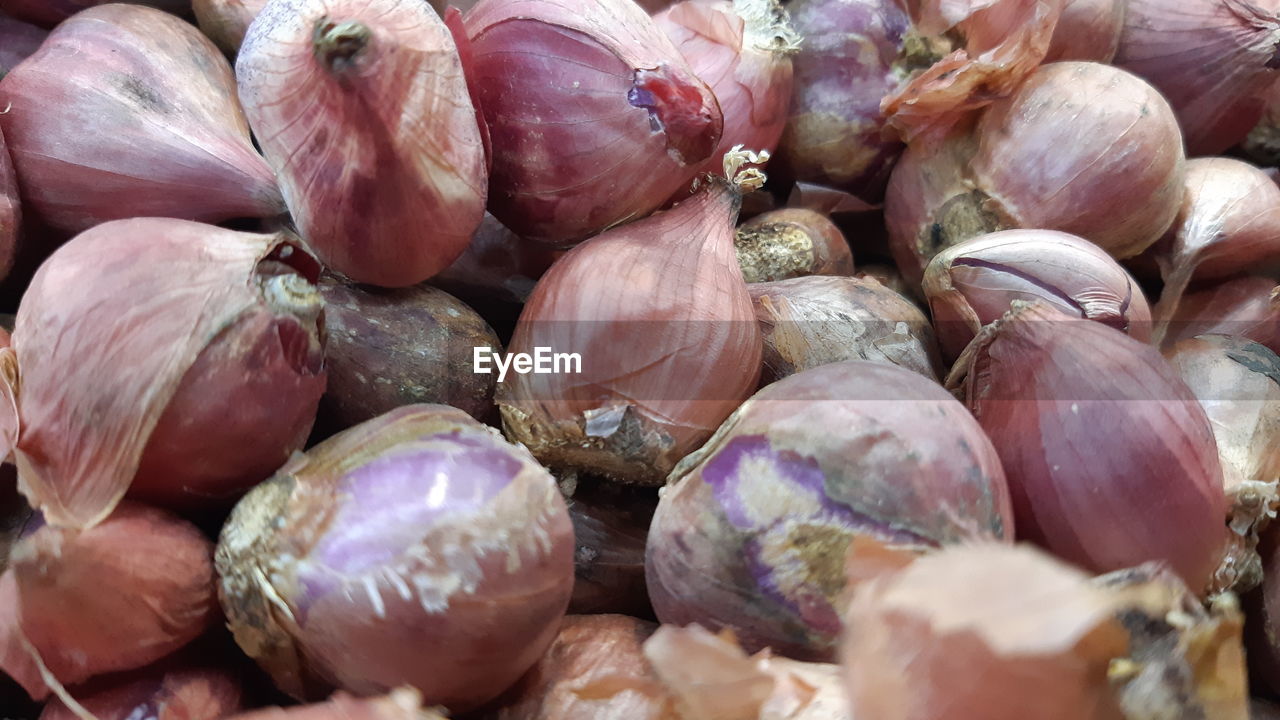 Full frame shot of onions for sale in market