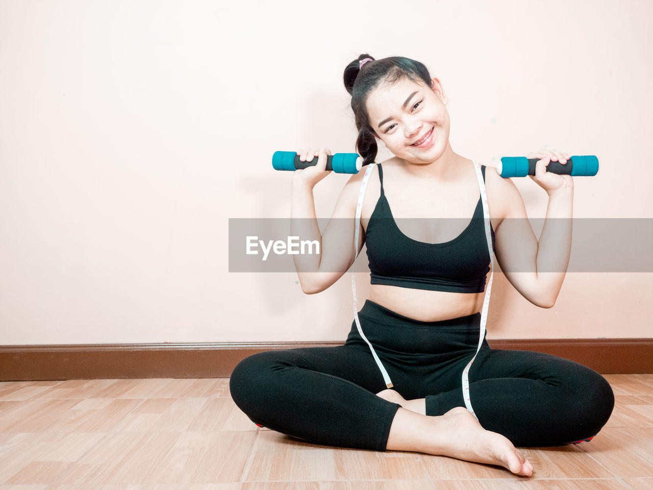 Lose belly fat concept from asian woman in sportswear with working out.