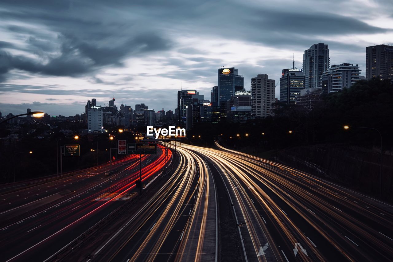 Light trails on road in city at night