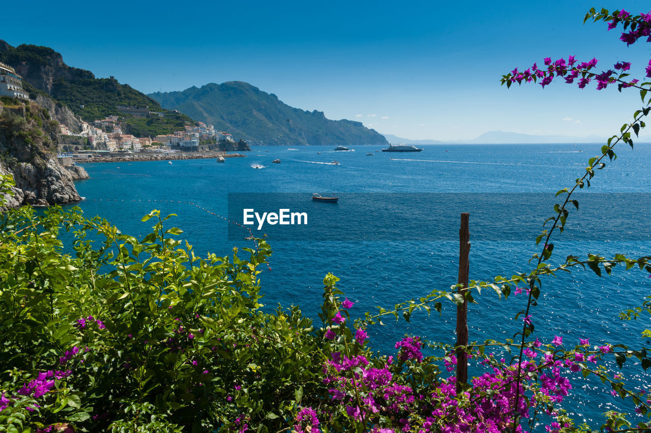 Scenic view of sea against blue sky