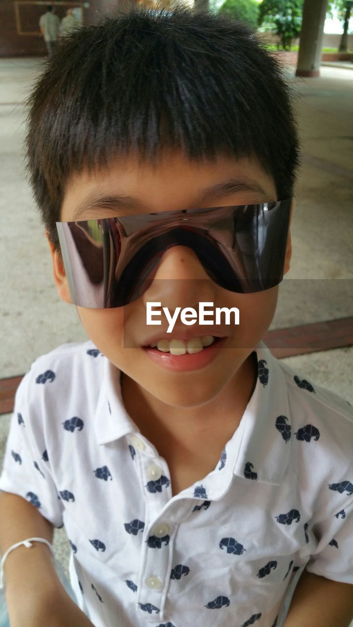 High angle view of boy with sunglasses