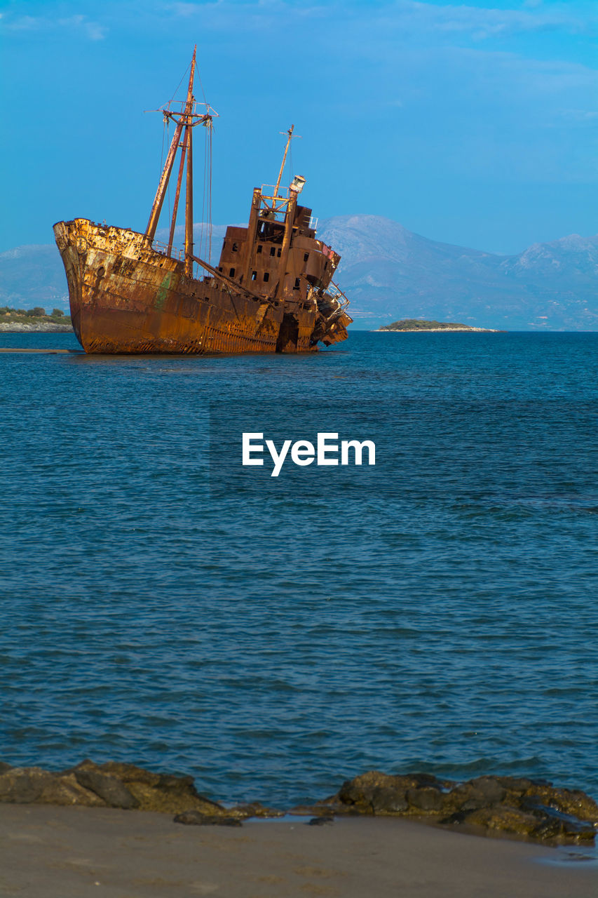 SAILBOAT ON SEA SHORE