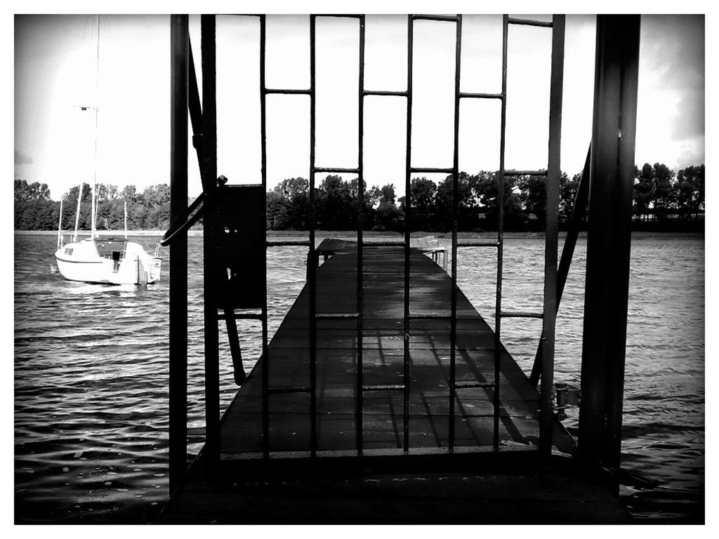 Metal door on pier on lake